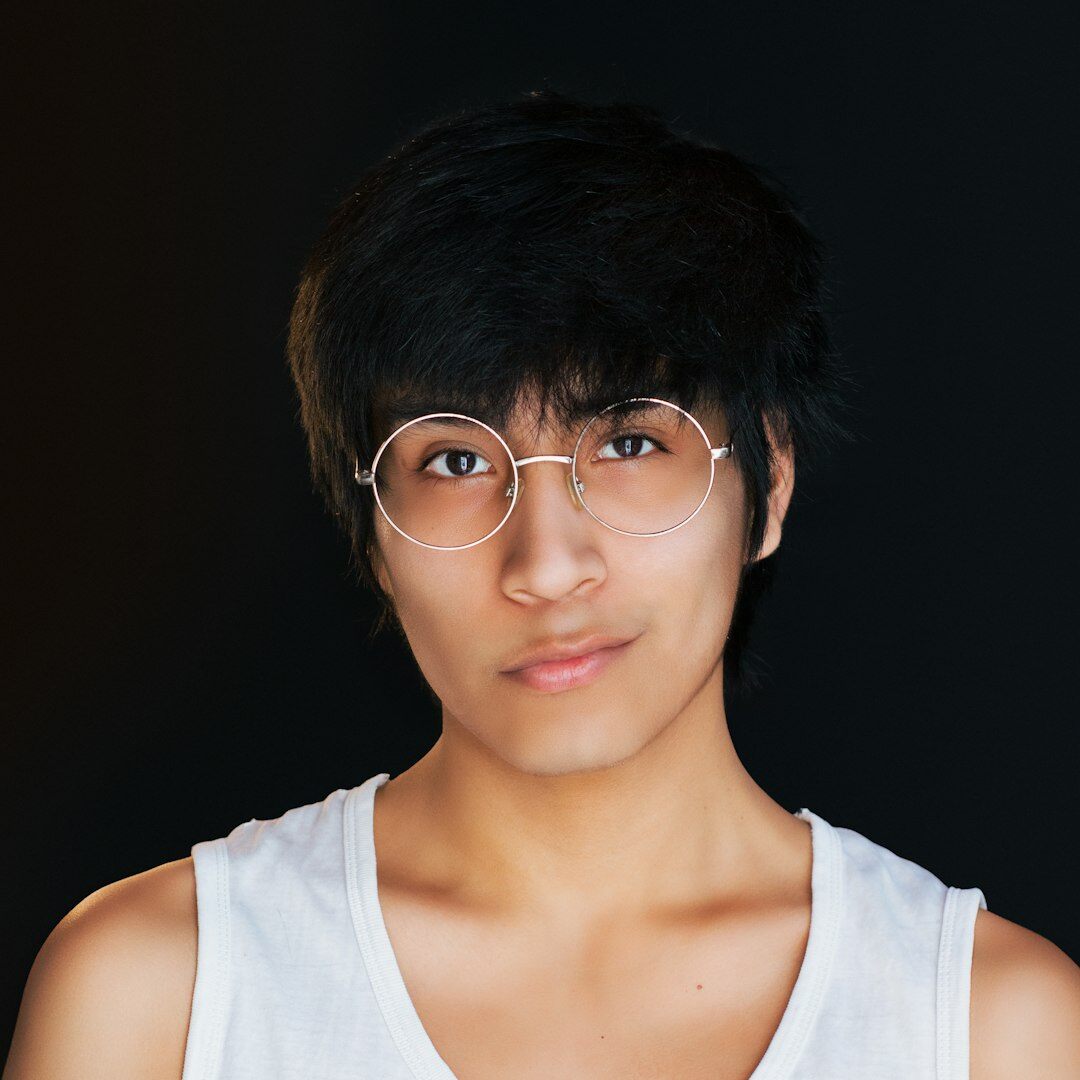 Portrait of a smiling young Brazilian woman with glasses
