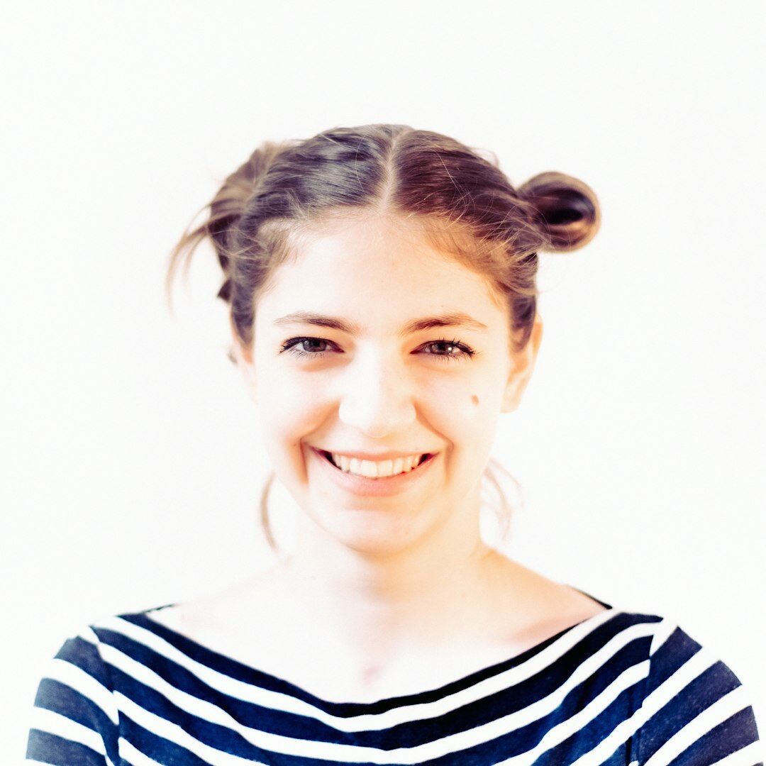 Portrait of a smiling Brazilian woman with curly hair